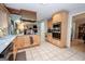 Well-equipped kitchen with tile floors, wood cabinets, and stainless steel appliances at 112 Kirton Turn, Peachtree City, GA 30269