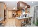 Updated kitchen featuring an island with seating, stainless steel appliances, and granite counters at 112 Kirton Turn, Peachtree City, GA 30269