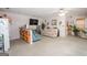 Open basement living room with kitchenette, comfortable seating, and lots of space at 112 Kirton Turn, Peachtree City, GA 30269