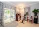 Inviting living room with sliding glass doors leading to outdoor seating area at 112 Kirton Turn, Peachtree City, GA 30269