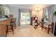 Living room with hardwood flooring and sliding glass doors that lead to the back yard at 112 Kirton Turn, Peachtree City, GA 30269
