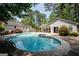 Aerial view of a pool with lush trees surrounding property at 112 Kirton Turn, Peachtree City, GA 30269