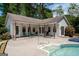 Backyard pool and patio area with seating, an in-ground spa, and mature landscaping at 112 Kirton Turn, Peachtree City, GA 30269