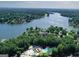 Aerial view of a community pool, lake, and luxury homes at 1155 Graystone Xing, Alpharetta, GA 30005