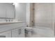 Modern bathroom with a tiled shower, toilet, and vanity offers a clean and functional space at 1155 Graystone Xing, Alpharetta, GA 30005