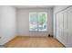 Cozy bedroom with natural light from a window and a closet for ample storage at 1155 Graystone Xing, Alpharetta, GA 30005