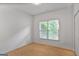 Bright, airy bedroom with a large window and wood flooring provides a peaceful retreat at 1155 Graystone Xing, Alpharetta, GA 30005