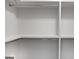 Interior view of a walk-in closet with metal rods and shelving, ready for organization at 1155 Graystone Xing, Alpharetta, GA 30005