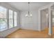 Cozy dining room with ample natural light and hardwood floors at 1155 Graystone Xing, Alpharetta, GA 30005