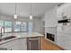 Modern kitchen island with stainless steel appliances and ample counter space at 1155 Graystone Xing, Alpharetta, GA 30005