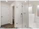 Modern bathroom features a glass shower, white subway tile, and wood-look tile floors at 1804 Quaker St, Hampton, GA 30228