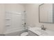 Full bathroom with tub, shower, vanity, and framed mirror at 1804 Quaker St, Hampton, GA 30228