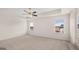Spacious bedroom featuring neutral carpet and ceiling fan at 1804 Quaker St, Hampton, GA 30228