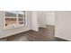 Open-concept living space features dark floors and a window, blending style and natural light at 1804 Quaker St, Hampton, GA 30228