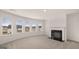 Sitting area with a fireplace and large windows overlooking the neighborhood at 1804 Quaker St, Hampton, GA 30228