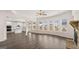 Open-concept living space with modern kitchen and living area with a fireplace at 1804 Quaker St, Hampton, GA 30228