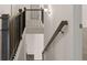 Top view of a staircase with stained handrail and white risers, leading to the upper floor at 1804 Quaker St, Hampton, GA 30228