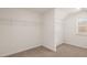 Spacious walk-in closet with wire shelving and a window for natural light at 1804 Quaker St, Hampton, GA 30228