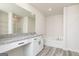 Serene bathroom with granite counters, dual sinks, soaking tub, and glass-enclosed shower at 458 Prescott Way, Villa Rica, GA 30180