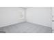 This is a bedroom with plush carpeting and a window view of the outdoors at 458 Prescott Way, Villa Rica, GA 30180