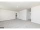 Expansive bedroom featuring plush carpet, neutral walls, and access to the ensuite bathroom at 458 Prescott Way, Villa Rica, GA 30180