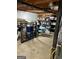 Unfinished basement area offering ample storage and workshop space with shelving units at 142 Carrollwood Dr, Fayetteville, GA 30215