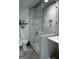 Modern bathroom featuring a glass-enclosed shower with gray tiling and a sleek vanity at 142 Carrollwood Dr, Fayetteville, GA 30215