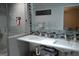 Modern bathroom features a double sink vanity, stylish tile, and a glass-enclosed shower with tiled walls and a niche at 142 Carrollwood Dr, Fayetteville, GA 30215