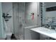 Modern bathroom featuring a glass-enclosed shower with gray tiling and a sleek vanity at 142 Carrollwood Dr, Fayetteville, GA 30215