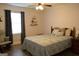 Cozy bedroom featuring a comfortable bed with decorative pillows and a serene window view at 142 Carrollwood Dr, Fayetteville, GA 30215