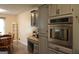 Eat-in kitchen featuring gray cabinets and stainless steel appliances at 142 Carrollwood Dr, Fayetteville, GA 30215