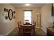 Charming dining room with hardwood floors and a classic table set at 142 Carrollwood Dr, Fayetteville, GA 30215