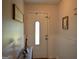 Inviting foyer with white wainscoting and a decorative front door at 142 Carrollwood Dr, Fayetteville, GA 30215