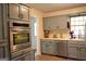 Updated kitchen with gray cabinets, stainless steel oven and dishwasher at 142 Carrollwood Dr, Fayetteville, GA 30215