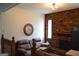 Cozy living space with brick fireplace and comfortable seating at 142 Carrollwood Dr, Fayetteville, GA 30215