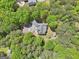 Aerial view of a home surrounded by verdant trees, highlighting the property's seclusion at 270 Morrow Rd, Newborn, GA 30056