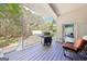 Cozy covered back porch with grill and outdoor seating, perfect for enjoying the serene wooded surroundings at 270 Morrow Rd, Newborn, GA 30056