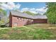 Well-maintained backyard with lush lawn, offering ample space for recreation and entertainment, set against a brick home at 270 Morrow Rd, Newborn, GA 30056