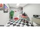 Finished basement with checkered tile, coca-cola decor, and stairwell at 270 Morrow Rd, Newborn, GA 30056