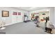 Spacious basement area with gym equipment, fan, and glass paneled french doors at 270 Morrow Rd, Newborn, GA 30056