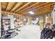 Unfinished basement with stud framing, boxes, and stored furniture at 270 Morrow Rd, Newborn, GA 30056