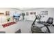 Basement features a TV area, workout equipment, and glass paneled french doors at 270 Morrow Rd, Newborn, GA 30056