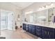 Bathroom featuring a large vanity with dual sinks and a large mirror at 270 Morrow Rd, Newborn, GA 30056