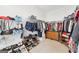 Walk-in closet featuring ample shelving, hanging space, and storage for clothes and shoes at 270 Morrow Rd, Newborn, GA 30056