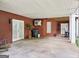 A covered patio with double doors, brick columns, and finished ceiling at 270 Morrow Rd, Newborn, GA 30056