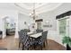 Elegant dining room features modern chandelier, tray ceiling and decorative chairs at 270 Morrow Rd, Newborn, GA 30056