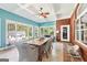 Sunroom featuring a dining table, wicker furniture, and several large windows at 270 Morrow Rd, Newborn, GA 30056