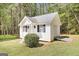 Cozy cottage with a convenient side ramp addition nestled on a well-maintained lawn at 270 Morrow Rd, Newborn, GA 30056