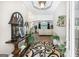 Spacious foyer with hardwood floors, a decorative rug, and a view of the living area, offering a welcoming atmosphere at 270 Morrow Rd, Newborn, GA 30056