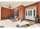Charming front porch featuring a tiled floor, ceiling fan, and comfortable seating, ideal for enjoying outdoor moments at 270 Morrow Rd, Newborn, GA 30056
